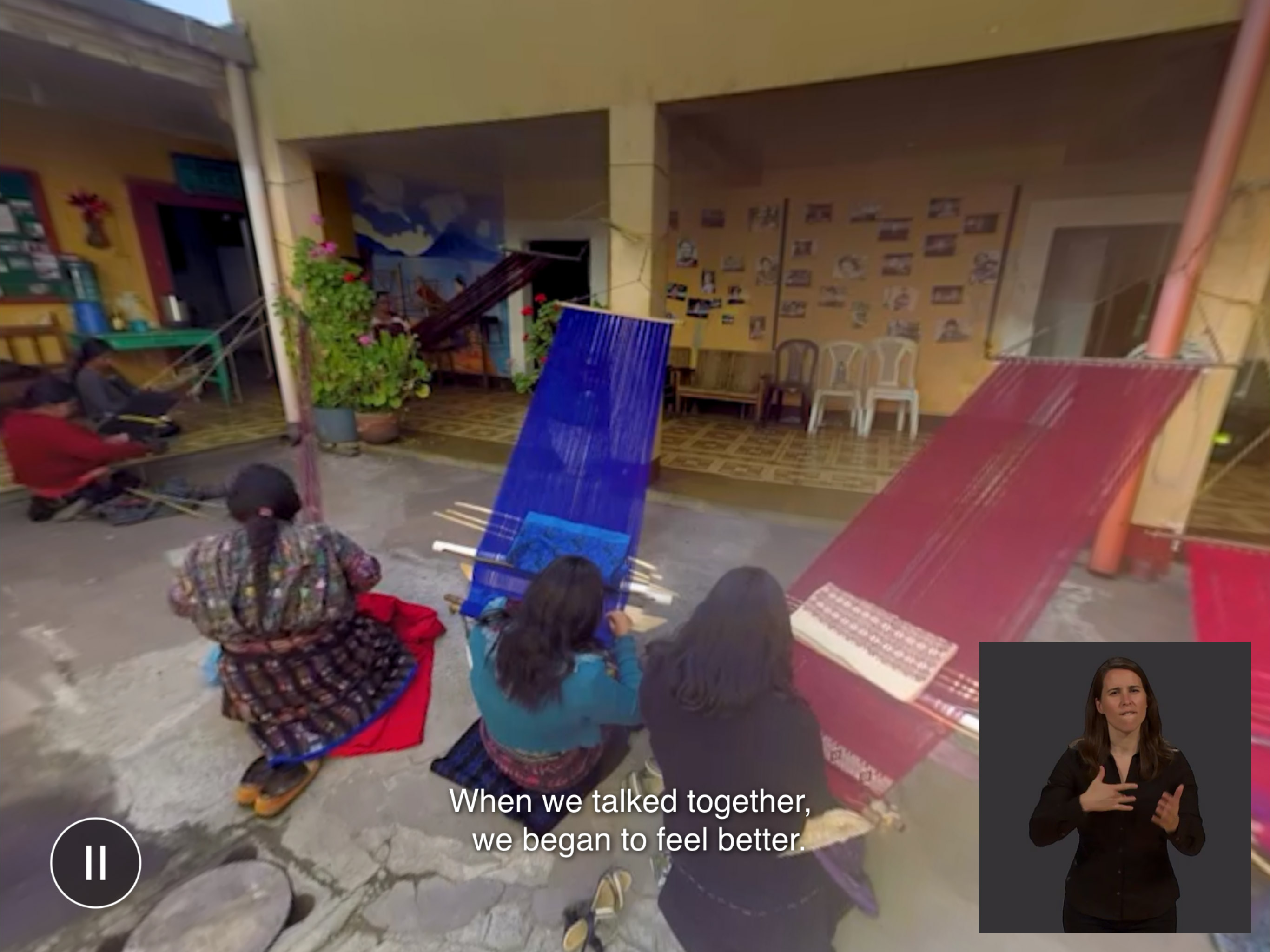 Outdoor scene of women weaving with sign language interpreter in the lower right of the screen.