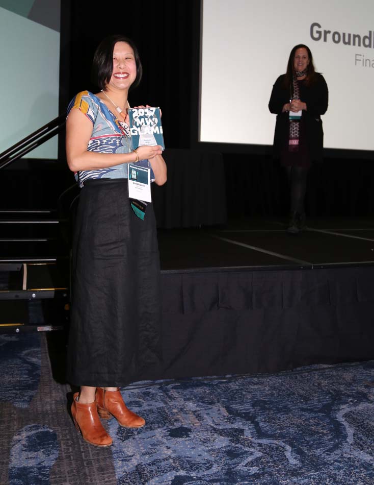 A recipient of a GLAMi Award in 2017 shows off her trophy.