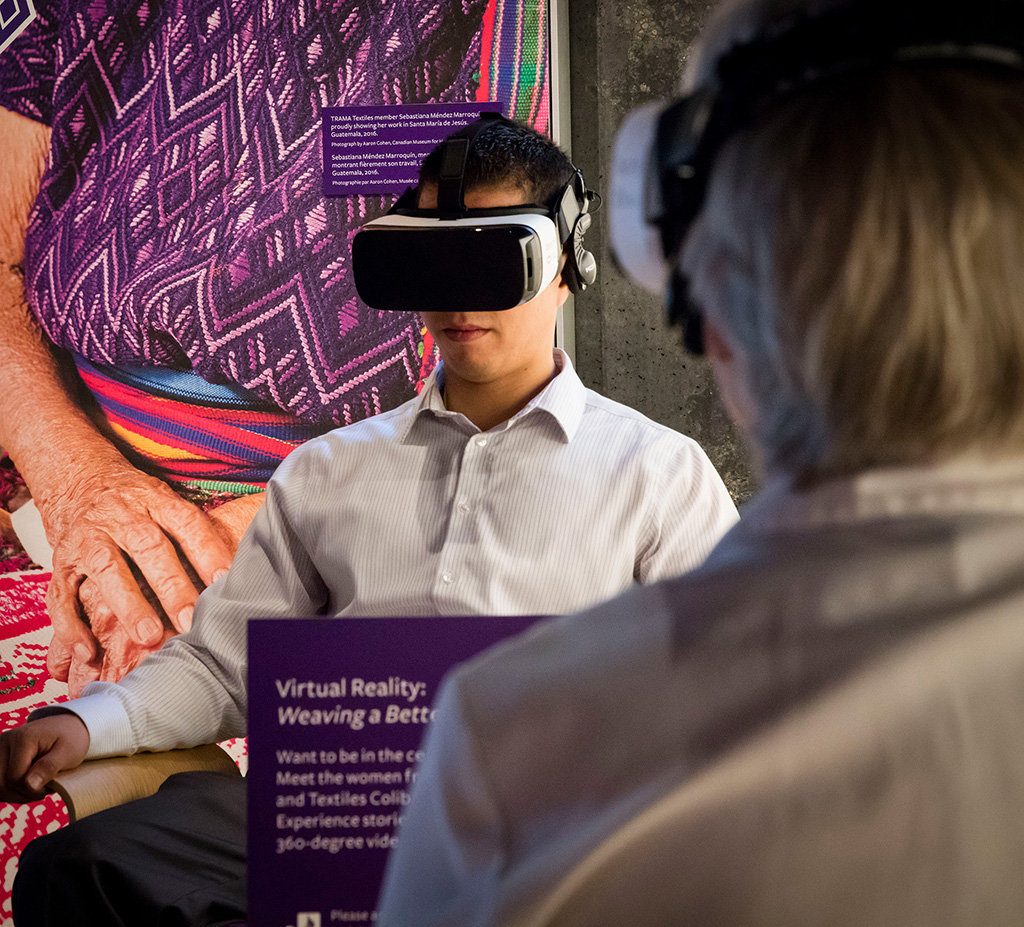 Person sitting in swivel chair with virtual reality headset on.