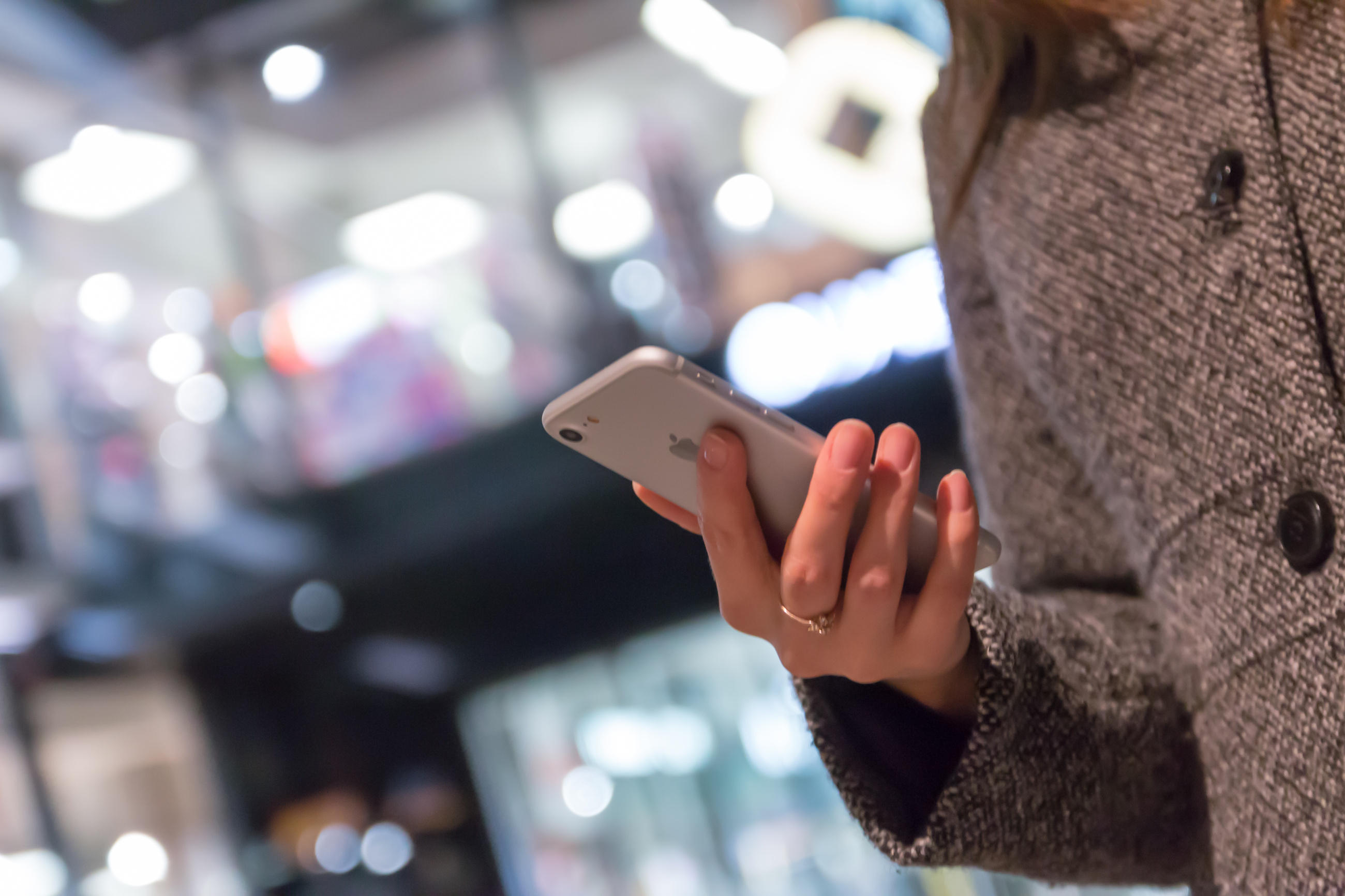 Scholarships and Volunteers: A Woman Holds a Smartphone